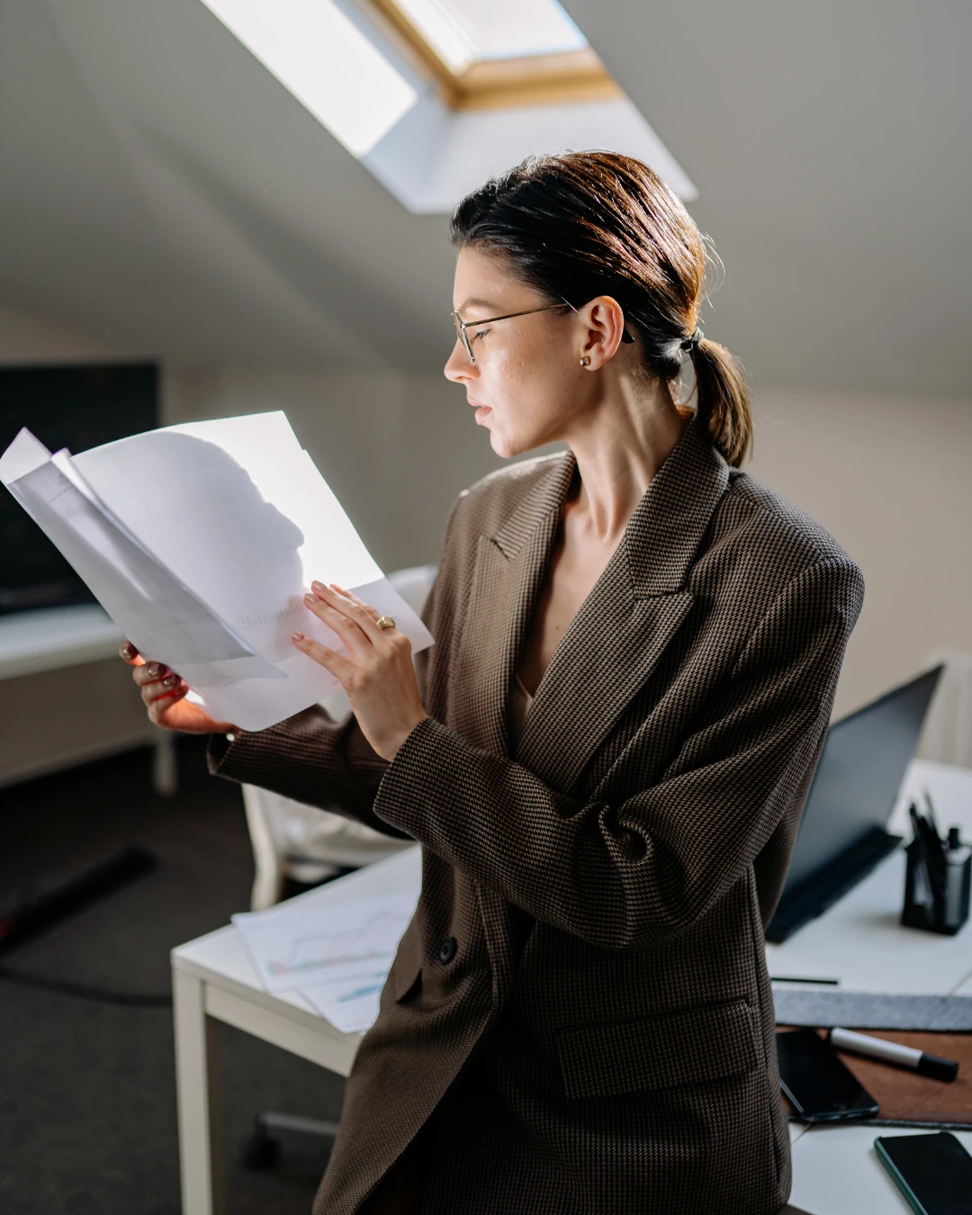 A professional reviewing workplace documents.